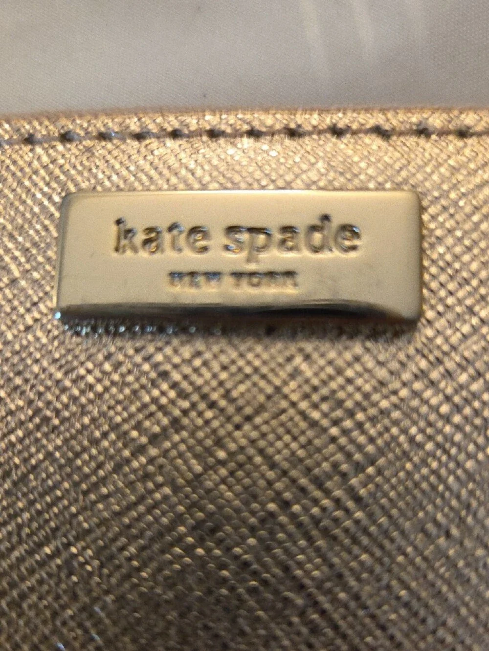 kate spade metallic rose gold zip-around wallet